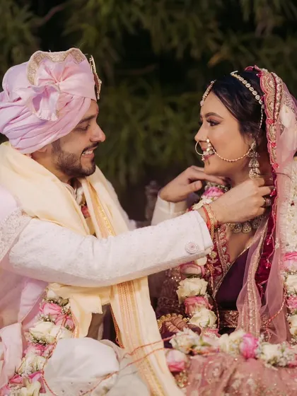 A sweet moment of adjustment and care during the wedding ceremony. It's the small, loving gestures that reveal the depth of a couple's bond.