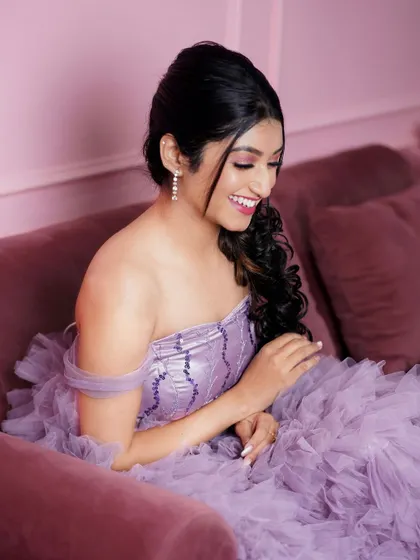 Capturing a candid, smiling moment in the beautiful lavender gown.