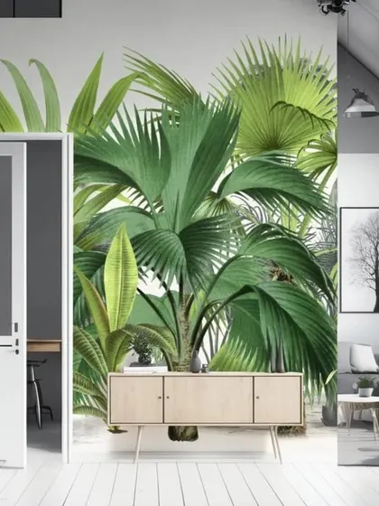 A bright and vibrant tropical leaf wallpaper that makes a fresh and energetic statement in this modern living space.