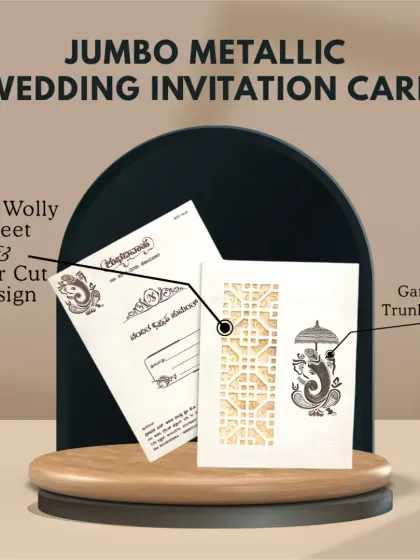 This jumbo metallic wedding invitation card features a laser-cut design and a Ganesha trunk sticker, blending modern techniques with traditional blessings.