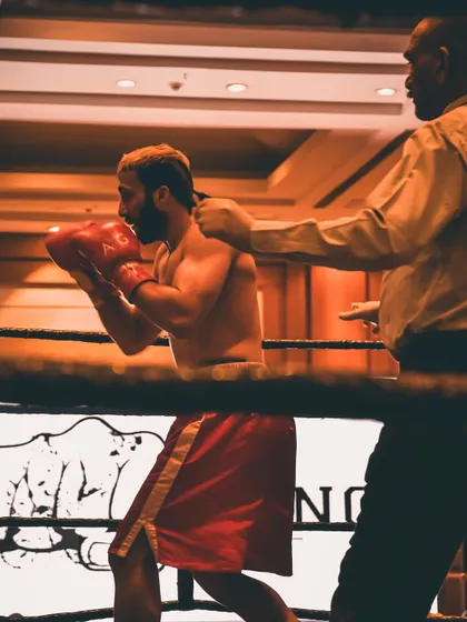The referee giving instructions during a professional fight. Every moment in the ring counts.