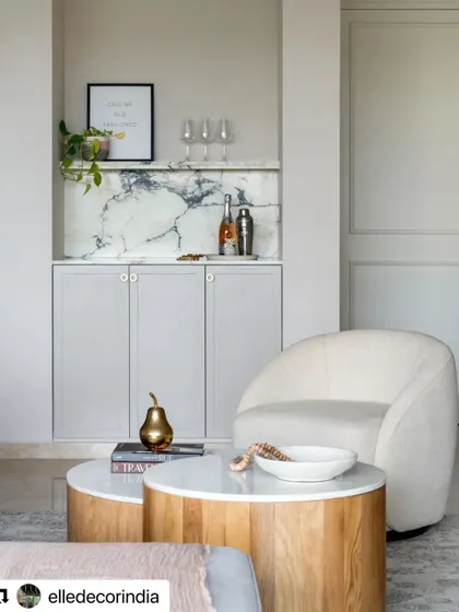 A detail of the living room in the Neutral Chic home, showing the built-in bar nook. The design proves that a neutral palette can be richly layered and full of interest.