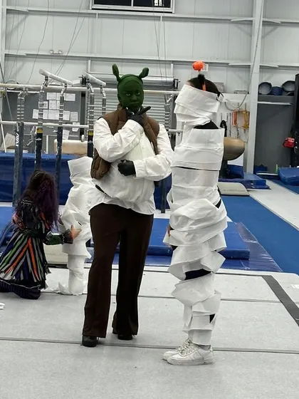 Even Shrek gets in on the mummy-wrapping action! Our coaches lead the fun, participating in games and ensuring all the kids are having a blast during our themed events.