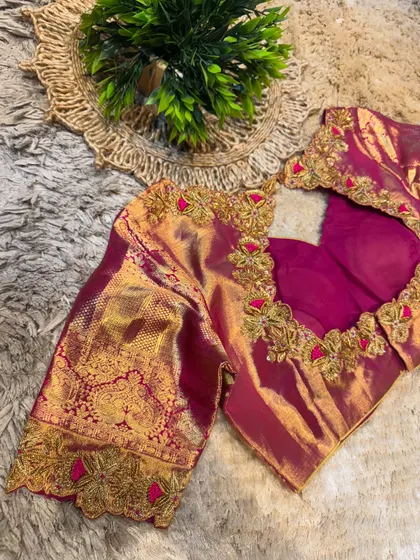 Another angle of the magenta blouse, emphasizing the shimmer of the silk and the intricacy of the gold and pink threadwork.