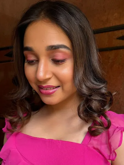 A close-up of the pink-toned eye makeup. I teach how to work with color in a way that is modern and sophisticated, not overpowering.
