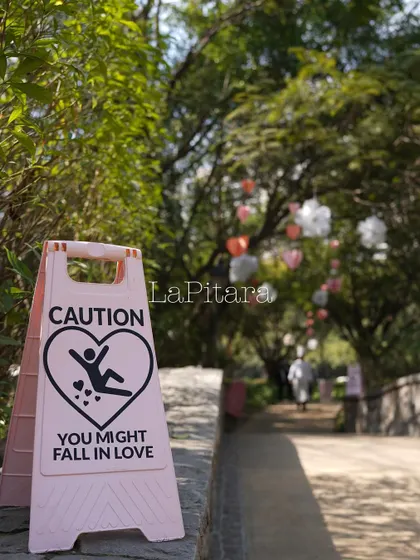 We love adding witty details. This custom "Caution: You Might Fall In Love" sign added a touch of humor and personality to the entrance of the Valentine's event.