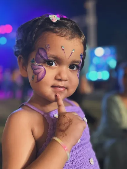 This little butterfly is ready to fly. We love how this purple butterfly design brings out her happy expression.