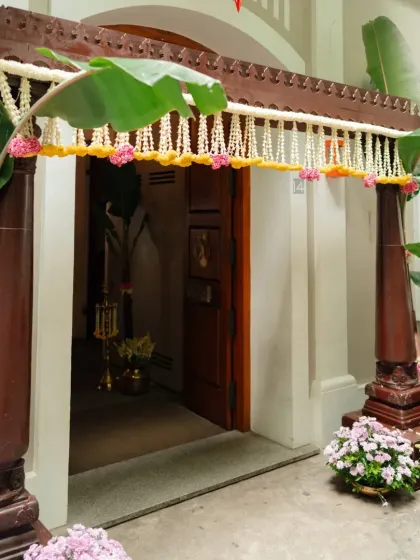 A fusion of cultures. For this North Indian couple who fell in love in Pondicherry, we designed a Haldi and Mehendi evening that blended traditional South Indian elements like banana leaves and brass lamps with vibrant floral decor.