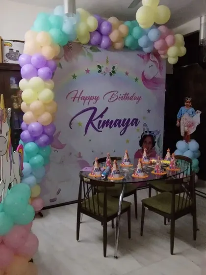 A unicorn-themed backdrop and balloon arch set up for a home birthday party for Kimaya. I can transform any space, big or small, into a magical celebration.