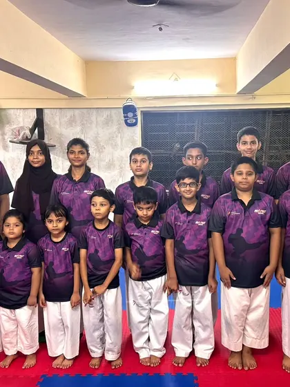 Another group of our dedicated students, standing together as a team. We welcome everyone to join our growing Taekwondo family.