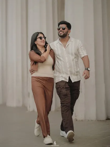 A cool, casual walking shot. The sunglasses and relaxed posture give this a very chic and contemporary feel.