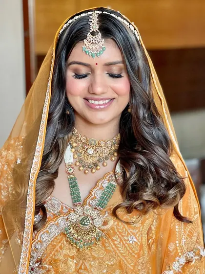 A close-up of the Phera makeup, with eyes closed to showcase the soft, smokey eyeshadow and the flawless, dewy skin.