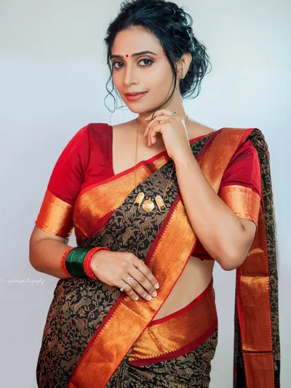 A series of studio portraits featuring a model in a black and red printed saree. The images range from expressive close-ups to elegant full-body shots, demonstrating versatile studio lighting.