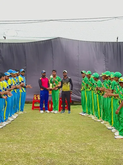 The captain of the runner-up team receiving the trophy.