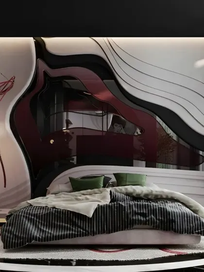 An avant-garde bedroom design with a custom, fluid-form headboard that incorporates reflective and textured surfaces. This is an example of our ability to create truly unique, artistic spaces for adventurous clients.