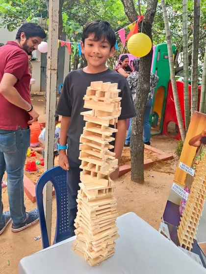 Even with a cast on his arm, this young builder was determined to create. It shows that the desire to build is powerful. He is exploring patterns and balance, proving that everyone can participate and achieve something they are proud of.