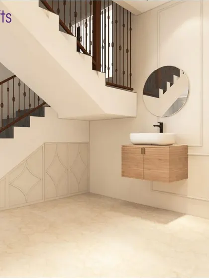 The area under the stairs is cleverly utilized in this modern minimalist villa in Heritage County, Bangalore. A floating washbasin and elegant wall paneling turn a functional space into a design feature.