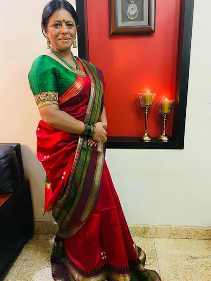 The full look for Day 2 of Navratri. The contrast of the red saree and the green embroidered blouse is simply stunning.
