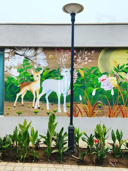 A beautiful nature scene at the Imperial Golf Resort, featuring two deer in a moonlit, flowering forest. This mural adds a touch of magic and serenity to the resort's exterior.