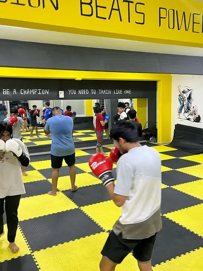 Another shot of our members practicing their boxing skills. The mirror helps fighters check their form and technique.