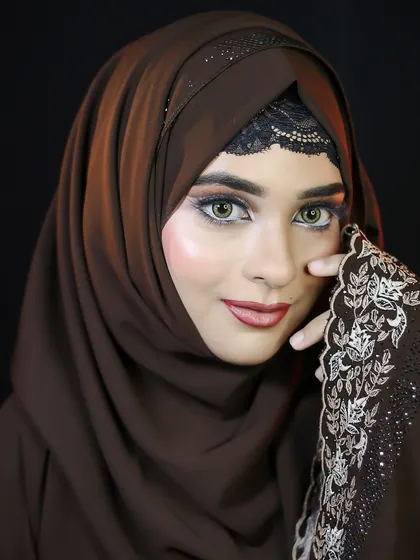 This portrait demonstrates how to create a glamorous and elegant makeup look that respects cultural attire, focusing on expressive eyes and flawless skin.