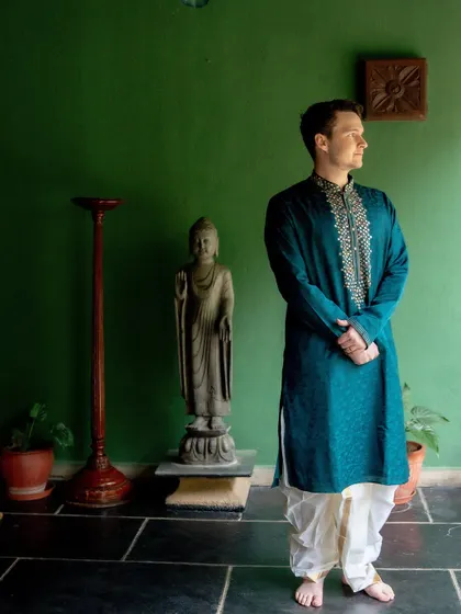 A portrait of the groom in his Indian attire, embracing the culture of his partner's family. We help in styling and sourcing outfits for our cross-cultural couples.