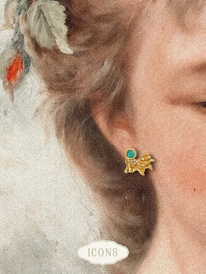 The Opaline Miniature Studs are a stunning rendition of the Odeta Floral Studs. The carved metal base with a pop of aquamarine makes them a unique and artistic choice for stud earrings.