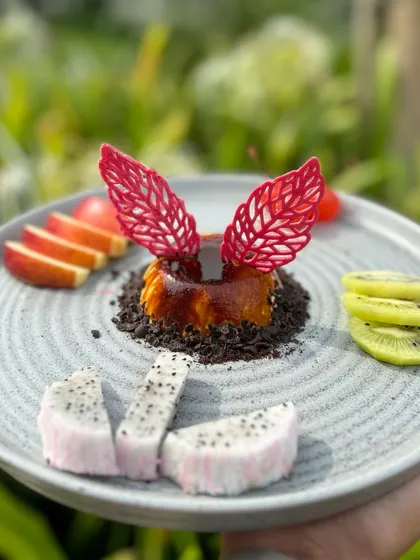 A hand-held shot of our beautiful and delicious coffee-infused panna cotta.