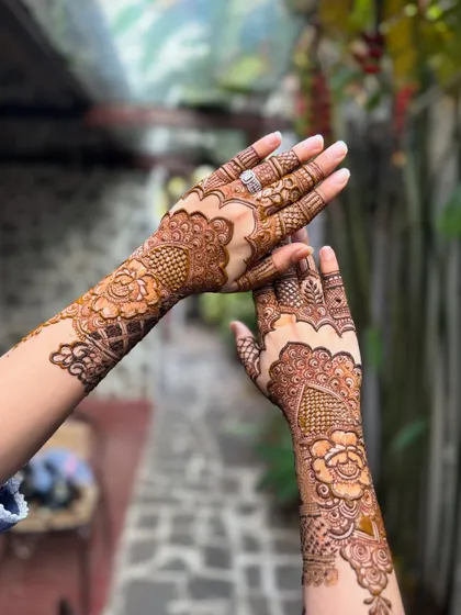 An artistic angle of the non-bridal henna, showcasing the design on both hands.