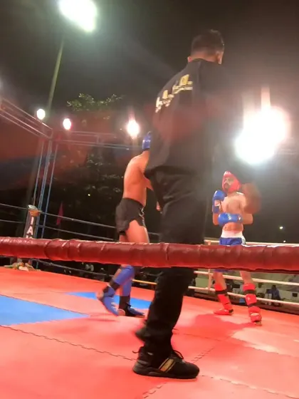 The fighters circle each other, looking for an opening in a technical K1 bout.