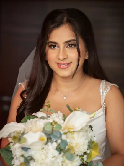 Another beautiful shot of this simple, elegant look. Her hair is styled in soft waves, and her skin is absolutely glowing.