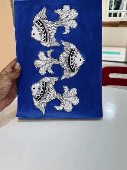 This is a classic Madhubani fish painting, a style known for its intricate patterns and symbolism. In my folk art classes, we learn the history and techniques to create pieces just like this.