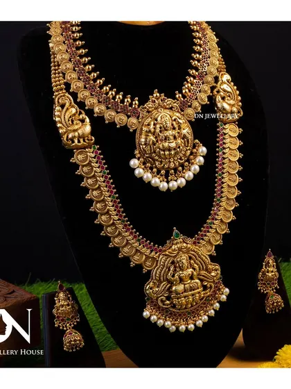 A layered temple jewellery set with two necklaces, perfect for a grand bridal look. The matching earrings complete the set.