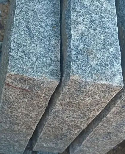 A close-up of the cut ends of natural stone pillars.