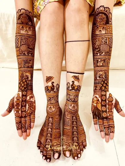 A full bridal set featuring bride and groom portraits, surrounded by traditional motifs like peacocks and elephants on both hands and feet.