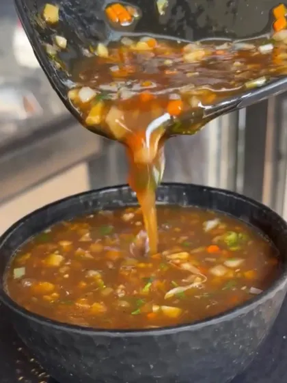 It's raining soup! A video showing my flavourful Manchow soup being poured into a bowl, perfect for a rainy day.