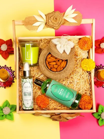 A flat-lay photograph of a skincare gift set against a colorful dual-tone background, creating a vibrant look for social media marketing.