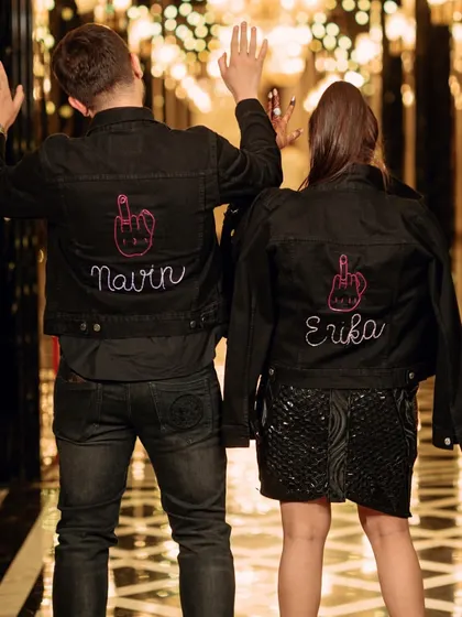 The couple showing off their custom "Just Married" jackets. A cool and edgy touch for the after-party.