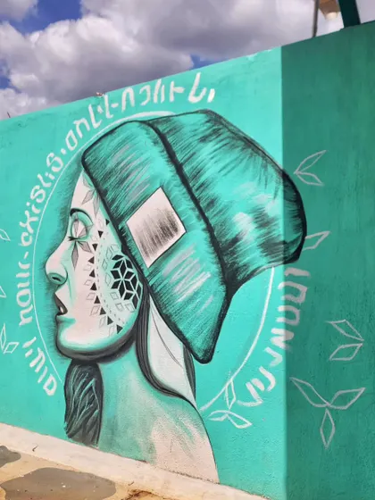 An angled view of the mural, showing its texture and how the artwork wraps around the corner.