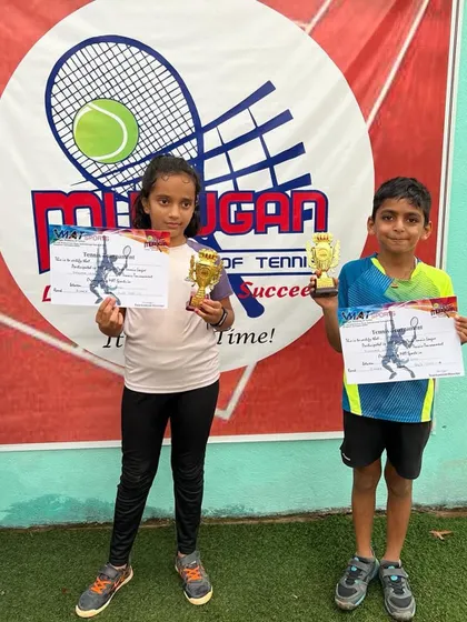 Avyaan and Ashvika posing with their winner and finalist trophies.