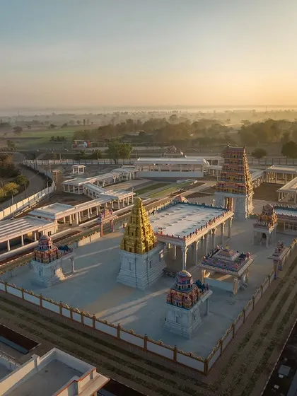 This is the Shiva Shakti Dham in Hubli, a 6.5-acre temple complex I designed to be a spiritual journey, not just a destination. This aerial view at sunrise captures the serene atmosphere and the scale of the master plan, which integrates traditional Dravidian architecture with modern facilities and landscape design.