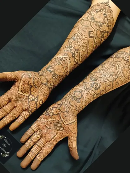 A complete bridal design covering both arms up to the elbows, featuring a mix of traditional Indian patterns for a classic and timeless look.