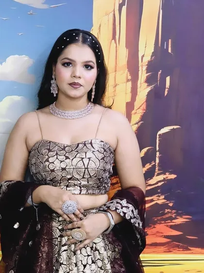 This model is wearing a contemporary lehenga with a spaghetti-strap blouse, paired with a modern American Diamond necklace set.