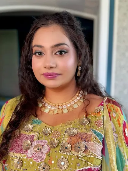 A close-up of the carnival makeup, featuring bright pink lips and shimmery eyeshadow.