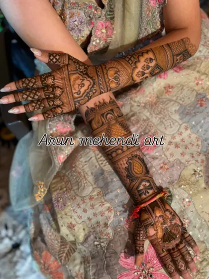 A beautiful design combining a bride portrait on the palm with intricate floral and geometric patterns on the arm.
