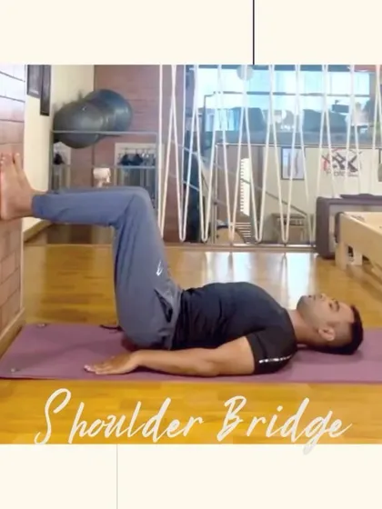 The shoulder bridge, shown here on the mat, is a foundational exercise for spinal health. It strengthens the muscles that support your back, helping to create stability and reduce pain.
