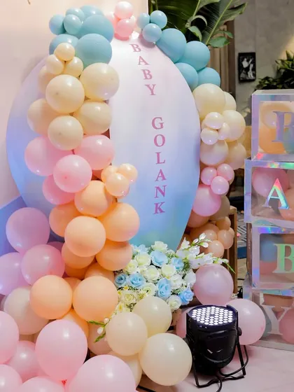Personalized details like these 'BABY' blocks and a custom 'Baby Golank' sign make the celebration feel truly unique.