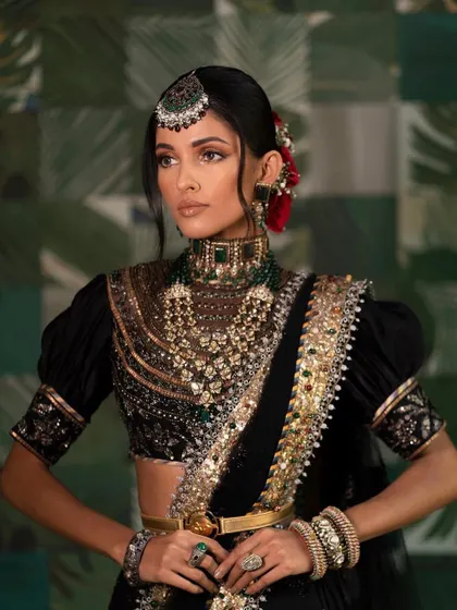 A regal and powerful bridal look in a black saree. I teach my students to be confident in using unconventional colors for bridal looks, creating something truly unique for their clients.