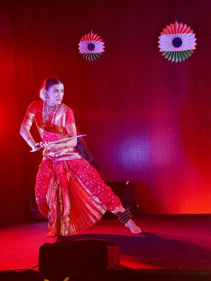 Performing in a dance drama for Independence Day celebrations in Reunion Island, France. Here I am portraying a warrior character, using a prop sword and a powerful stance to convey courage.