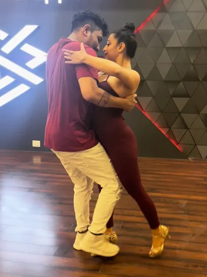 A snapshot of a close embrace in Bachata. This dance is all about the connection between partners, and we teach how to build that trust and chemistry.